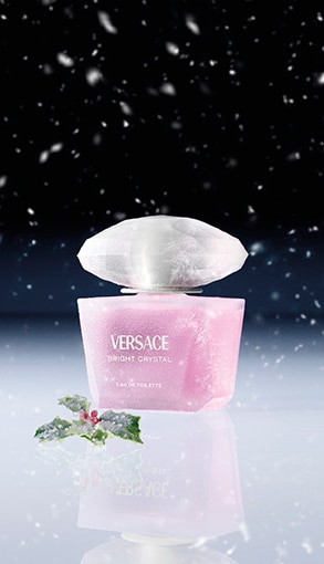 Versace Bright Crystal női parfüm rózsaszín üvegben, téli hangulatban hóeséssel – luxus illat online vásárláshoz.